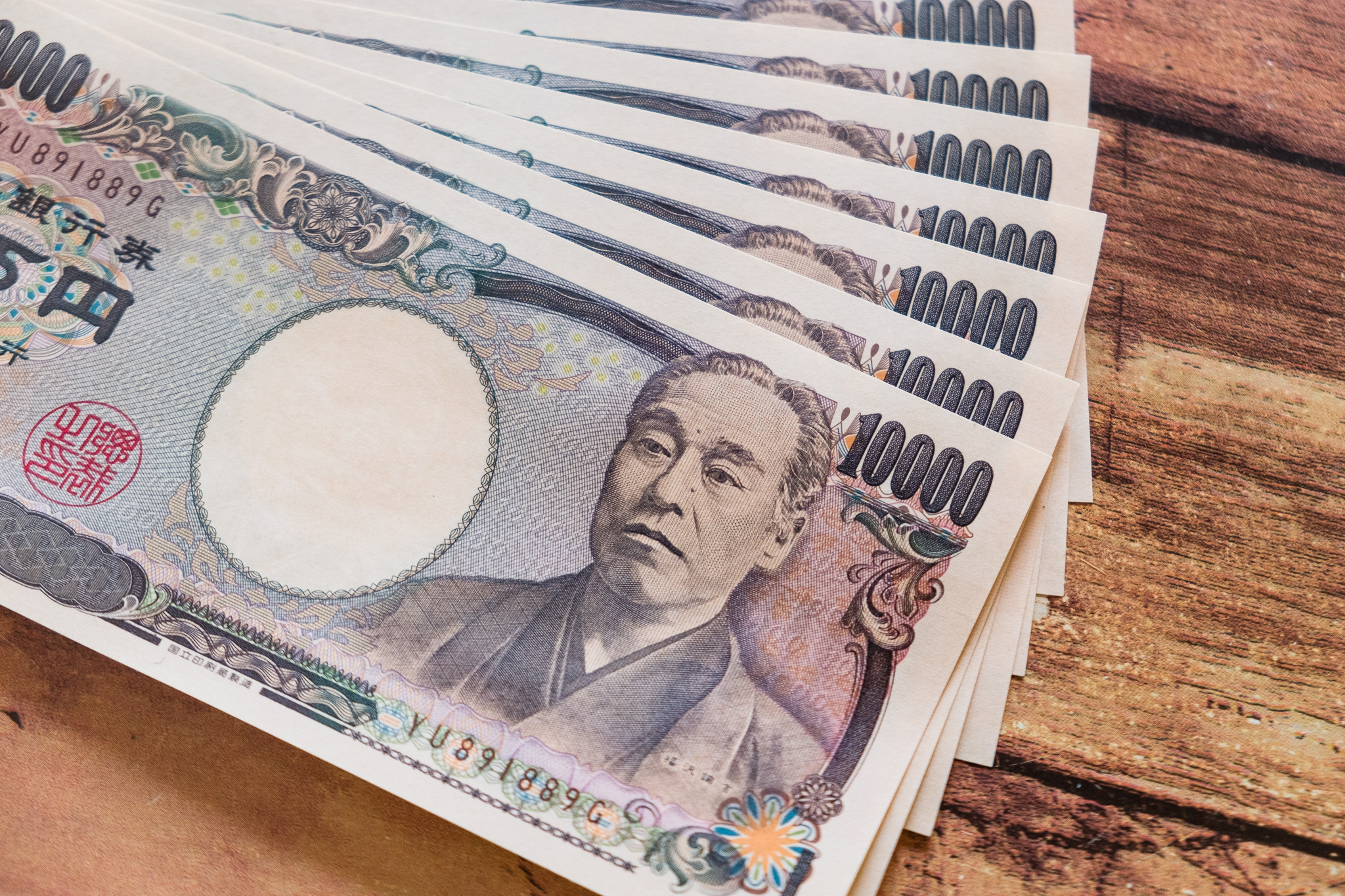 お金(一万円札10枚)の画像